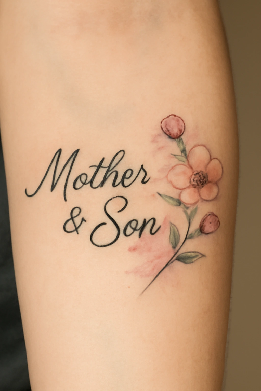 Elegant Script and Floral Design: Mother and Son Tattoo