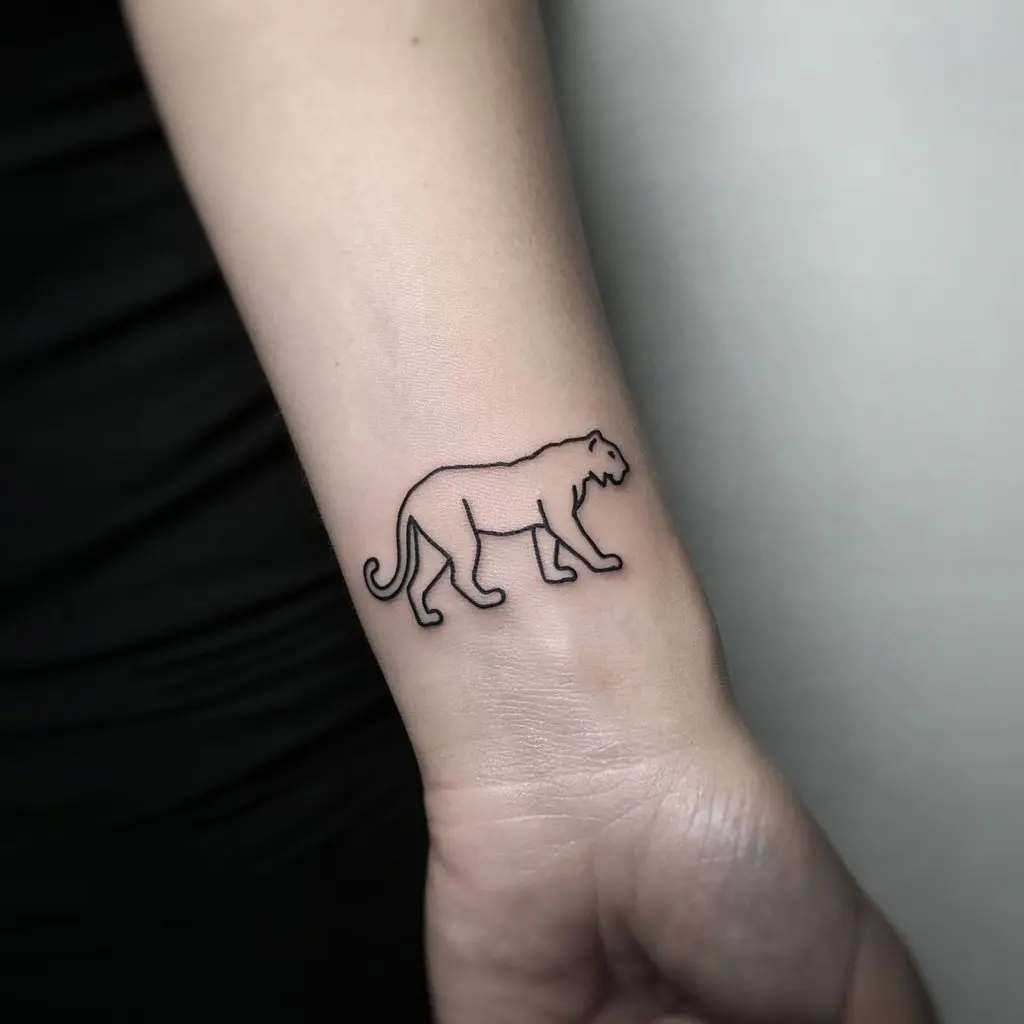 Minimalist tiger tattoo design outlined with a single fine line, placed on the wrist for a sleek and modern aesthetic.